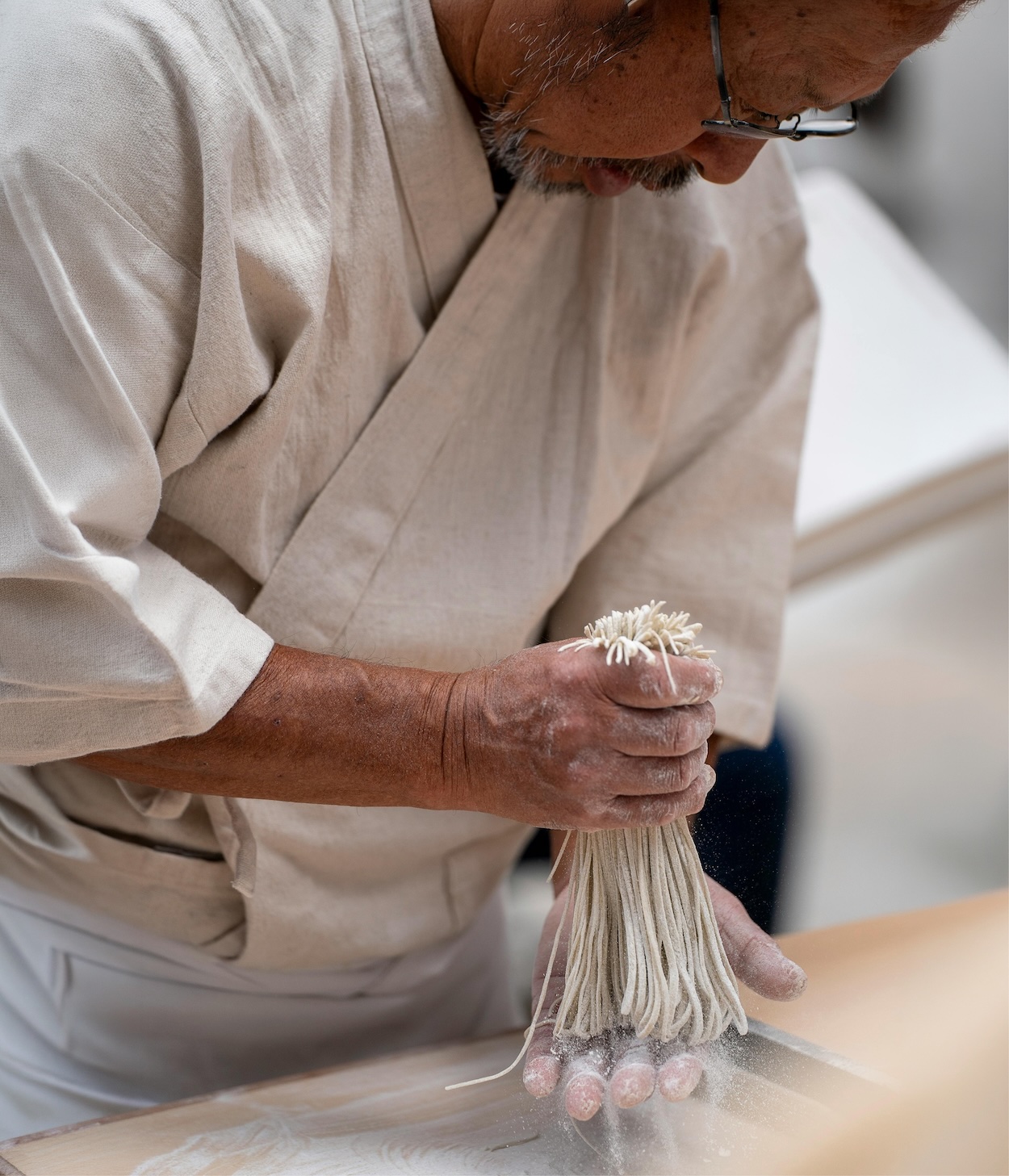 Person preparing fresh pasta by hand